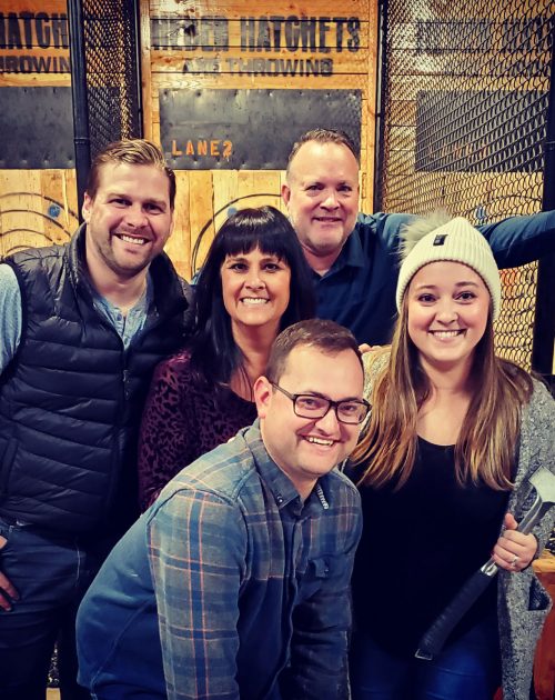 Amy and family axe throwing.